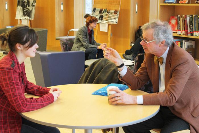 Durden ’71 talks with a student during his office hours. His next hours will be held on March 19th. 