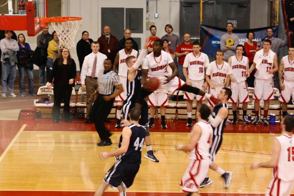 Chris Cox ’15 takes flight in front of 1,500 fans in the Red Devils’ 80-65 NCAA Tournament win. 