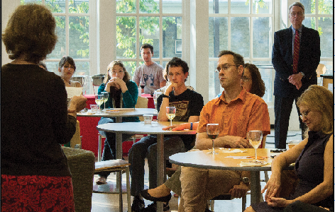 Attendees listen to Lape and Duperron’s FaculTea lecture series presentation on Oct. 2 in the Biblio.