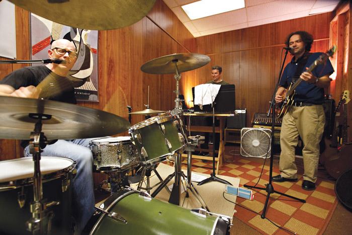 Members of the Faculty Band (from left, Seiler, Bender and Webb) rehearse in a practice space.