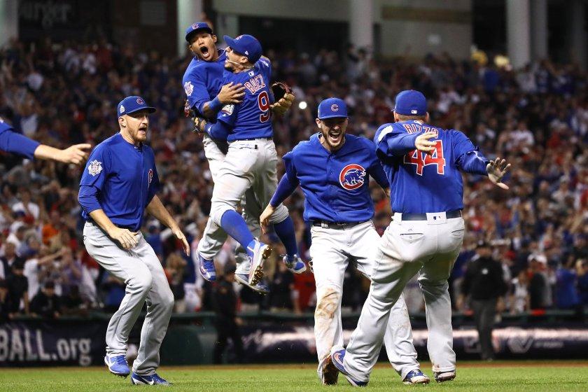 Cubs players celebrate after defeating multiple curses, winning first World Series in a century